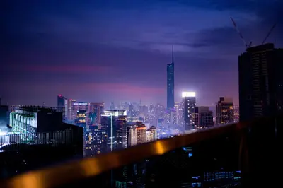 a view of a city skyline at night at Eaton Residences KLCC by Plush in Kuala Lumpur