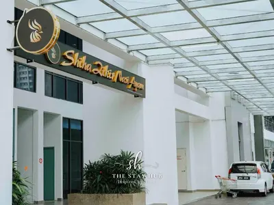 a sign on the side of a building at The Luxe & Colony KLCC Skyline Infinity Pool - 5min to Petronas Tower & KL City Center by The Stay Hub in Kuala Lumpur