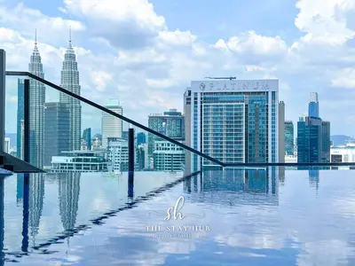 a view of the city from the top of a skyscraper at The Luxe & Colony KLCC Skyline Infinity Pool - 5min to Petronas Tower & KL City Center by The Stay Hub in Kuala Lumpur