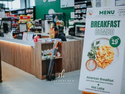 a sign for a grocery store with a bowl of food at The Luxe & Colony KLCC Skyline Infinity Pool - 5min to Petronas Tower & KL City Center by The Stay Hub in Kuala Lumpur