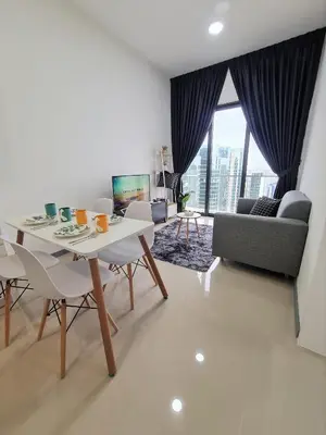 a living room with a table and chairs and a couch at Bangsar South Apartment by Sarah's Lodge @ SouthLink Lifestyle Apartment in Kuala Lumpur