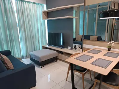 a living room with a table and a tv at Robertson Suites Bukit Bintang with Netflix in Kuala Lumpur