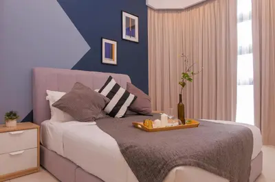 a bedroom with a bed with a tray on it at Robertson Suites Bukit Bintang with Netflix in Kuala Lumpur