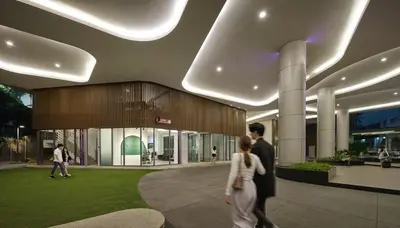 a man and a woman walking in a building at Robertson Suites Bukit Bintang with Netflix in Kuala Lumpur