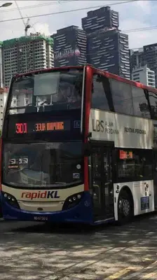 a double decker bus driving down a city street at Flexi check in 10min to KLCC next to Hospital Gleneagle in Kuala Lumpur
