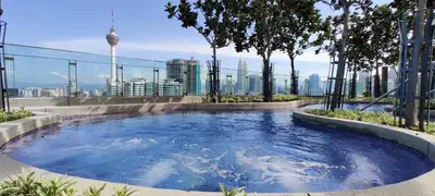 a hot tub on the roof of a building at Eclipse Suites Robertson Bukit Bintang in Kuala Lumpur