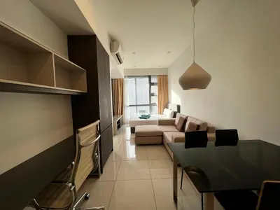 a living room with a couch and a table at Eclipse Suites Robertson Bukit Bintang in Kuala Lumpur
