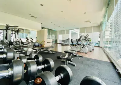a gym with a bunch of weights and machines at 2BR Tourists-Friendly Oasis - Heart of the City KL by Verano in Kuala Lumpur