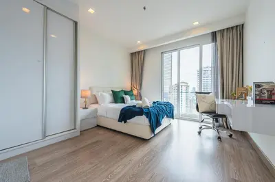 a white bedroom with a bed and a desk and window at 2BR Tourists-Friendly Oasis - Heart of the City KL by Verano in Kuala Lumpur