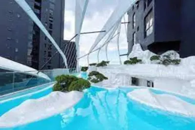 a swimming pool with snow on the roof of a building at Urban Duplex v Balcony- 2R2B Up to 7Pax, MontKiara by Verano in Kuala Lumpur