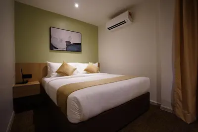 a bedroom with a large bed in a room at Dê MOCCIS Boutique Hotel in Kuala Lumpur