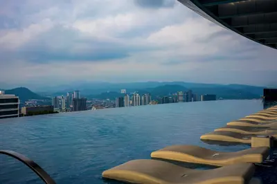 a swimming pool on top of a building with a city at Eaton Residence KLCC by Yemala in Kuala Lumpur