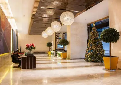 a christmas tree in the lobby of a mall at The Platinum KLCC By Crystal in Kuala Lumpur