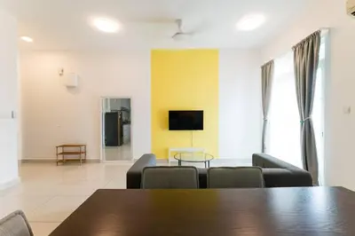 a living room with a table and chairs and a tv at TR Residence Lovely 3 BR unit 6pax next to Titiwangsa LRT in Kuala Lumpur