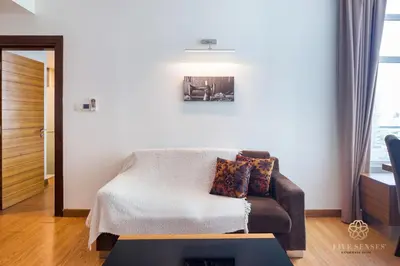 a living room with a couch and a table at Dua Sentral Kuala Lumpur, Roam in Kuala Lumpur