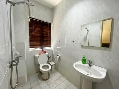 a bathroom with a toilet and a sink at Bukit Tunku KLCC Grande Villa 11 by Vale Pine in Kuala Lumpur