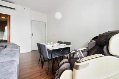 a room with a table and chairs and a couch at Una serviced Apartment in Kuala Lumpur