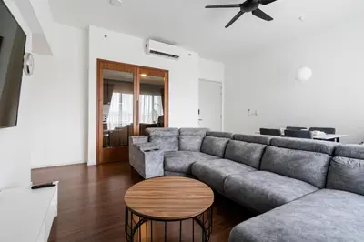 a living room with a couch and a table at Una serviced Apartment in Kuala Lumpur