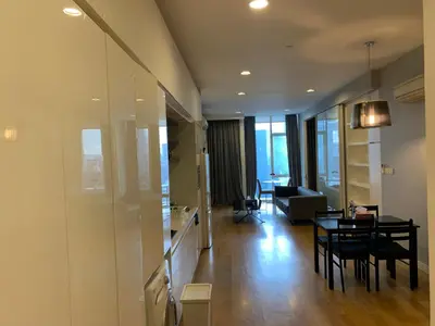 a living room with a table and a couch at Platinum Suites by Homie SkyBay in Kuala Lumpur