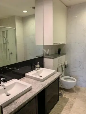 a bathroom with two sinks and a toilet at Platinum Suites by Homie SkyBay in Kuala Lumpur