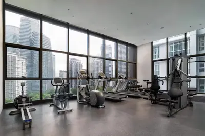 a gym with many treadmills and machines in a building at 8 Kia Peng KLCC by WSD in Kuala Lumpur