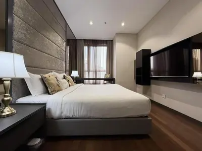 a bedroom with a large bed and a television at 8 Kia Peng KLCC by WSD in Kuala Lumpur