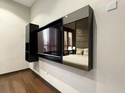 a bedroom with a large mirror on the wall at 8 Kia Peng KLCC by WSD in Kuala Lumpur