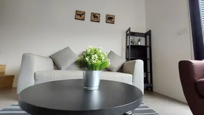 a black coffee table in a living room with a couch at KL Sentral Loft, EST Bangsar #8 in Kuala Lumpur