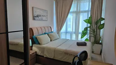 a bedroom with a bed with a large window at Aldridge Residence Coastal KLCC in Kuala Lumpur