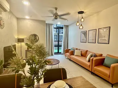 a living room with a couch and a table at New Arcoris Mont Kiara Huge Balcony for 8 pax 2 BR -Garden- in Kuala Lumpur