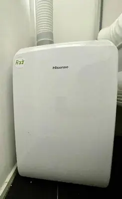 a white refrigerator freezer sitting in a room at New Arcoris Mont Kiara Huge Balcony for 8 pax 2 BR -Garden- in Kuala Lumpur