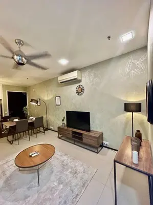 a living room with a flat screen tv on a wall at New Arcoris Mont Kiara Huge Balcony for 8 pax 2 BR -Garden- in Kuala Lumpur