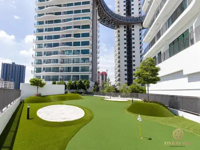 a golf course in the middle of a city with tall buildings at Datum Jelatek Sky Residence KLCC, Five Senses in Kuala Lumpur