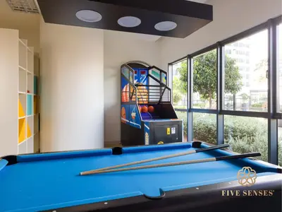 a game room with a pool table and a game system at Datum Jelatek Sky Residence KLCC, Five Senses in Kuala Lumpur