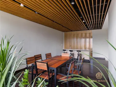 a dining room with a table and chairs and plants at Datum Jelatek Sky Residence KLCC, Five Senses in Kuala Lumpur