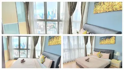 two pictures of a living room with a large window at Regalia Suites KLCC View Rooftop Infinity Pool by SHI in Kuala Lumpur