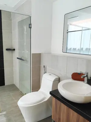 a bathroom with a toilet and a sink and a mirror at Panoramic City - Bangsar South Mid Valley in Kuala Lumpur
