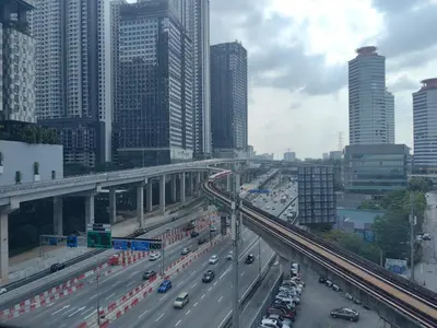 a busy highway in a city with cars and buildings at Panoramic City - Bangsar South Mid Valley in Kuala Lumpur