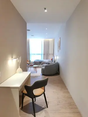 a living room with a couch and a chair at BTC The Curvena Bangsar South Mid Valley in Kuala Lumpur