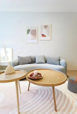 a living room with a couch and two tables at BTC The Curvena Bangsar South Mid Valley in Kuala Lumpur