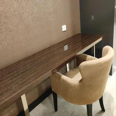 a wooden table with two chairs in a room at Dorsett Residence KL Private Studio apartment in Kuala Lumpur