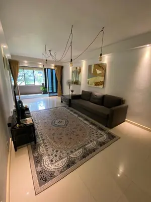 a living room with a couch and a rug at KLCC Studio One Bedroom in Kuala Lumpur
