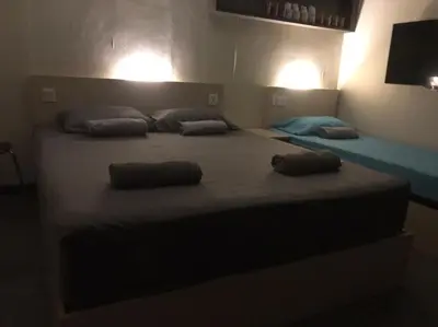 a bedroom with a large bed with two pillows on it at OA ThE FACTORY AT BUKIT BINTANG in Kuala Lumpur