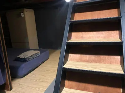 a ladder in a room with a bunk bed at OA ThE FACTORY AT BUKIT BINTANG in Kuala Lumpur