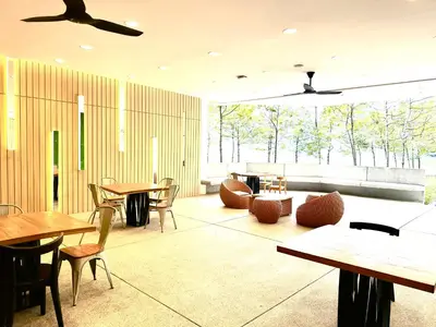 a restaurant with tables and chairs and a large window at The Robertson 2B at Bukit Bintang with Netflix,trx,klcc,pavilion,lalaport in Kuala Lumpur