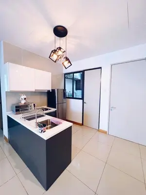 a large kitchen with a sink and a stove at Connected train 3 Bedrooms - ABOVE KLGATEWAY MALL 14 in Kuala Lumpur
