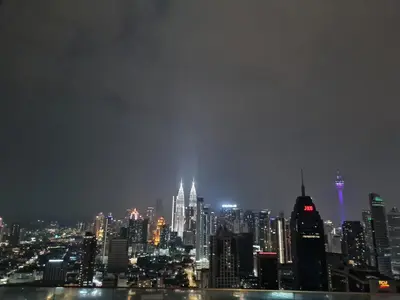 a view of a city skyline at night at Regalia skypool 969 in Kuala Lumpur