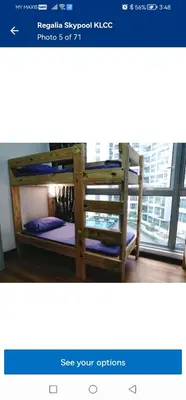 a picture of a bunk bed in a room with a window at Regalia skypool 969 in Kuala Lumpur