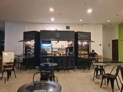 a restaurant with tables and chairs in a room at Regalia skypool 969 in Kuala Lumpur
