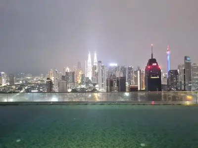 a view of a city skyline at night at Regalia skypool 969 in Kuala Lumpur